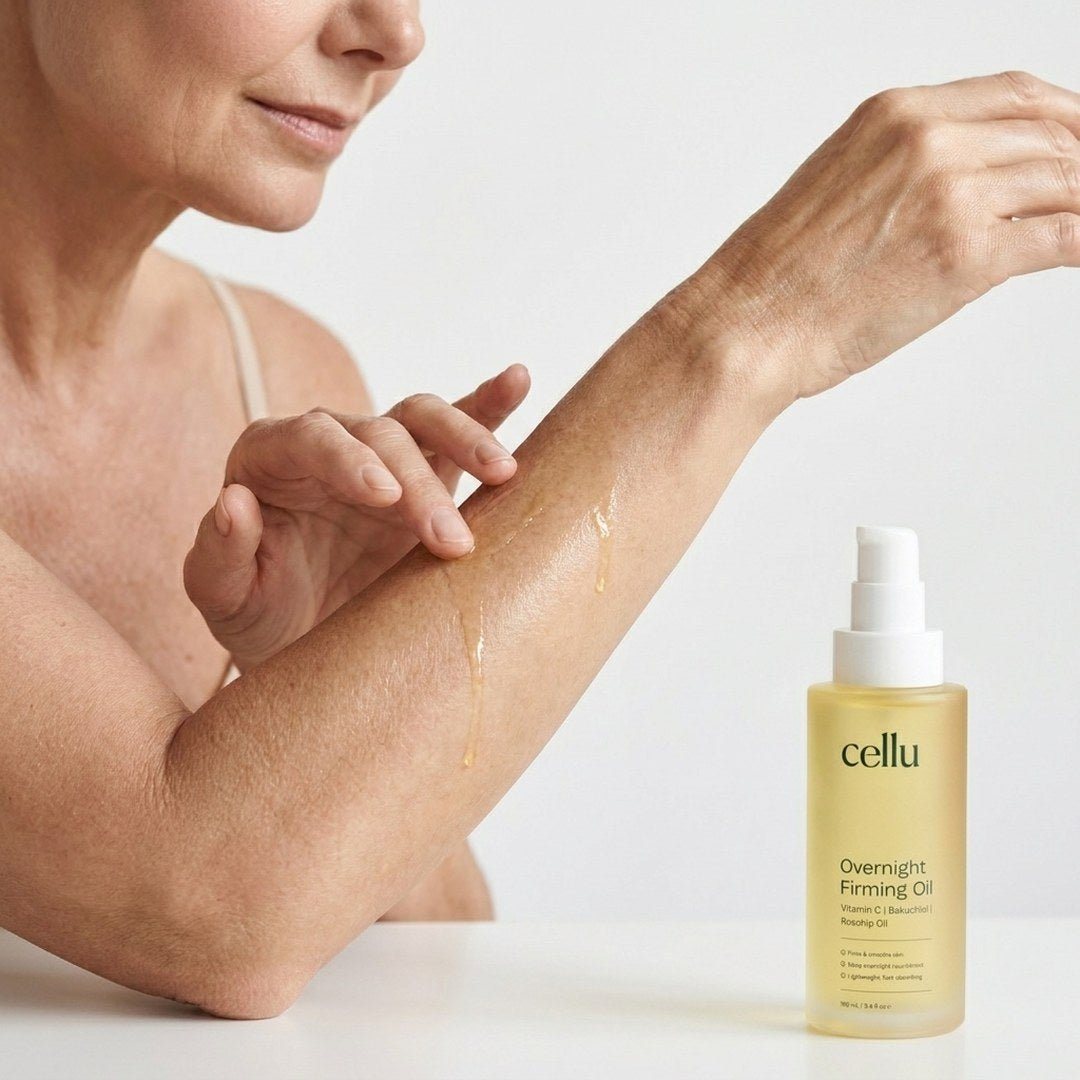 Woman smoothing a body oil onto her upper arm, with a bottle of Cellu Overnight Firming Oil beside her