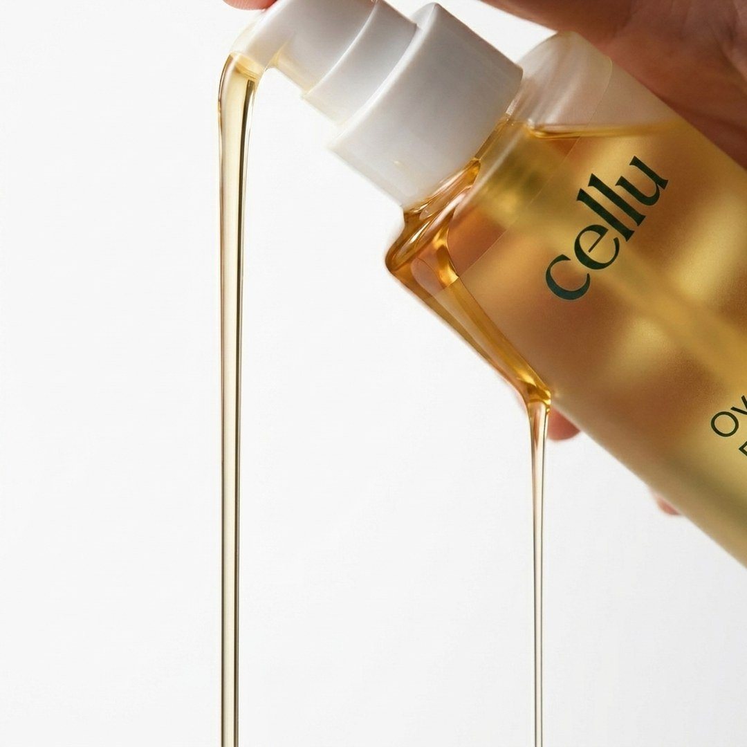 Golden oil pouring from a Cellu bottle